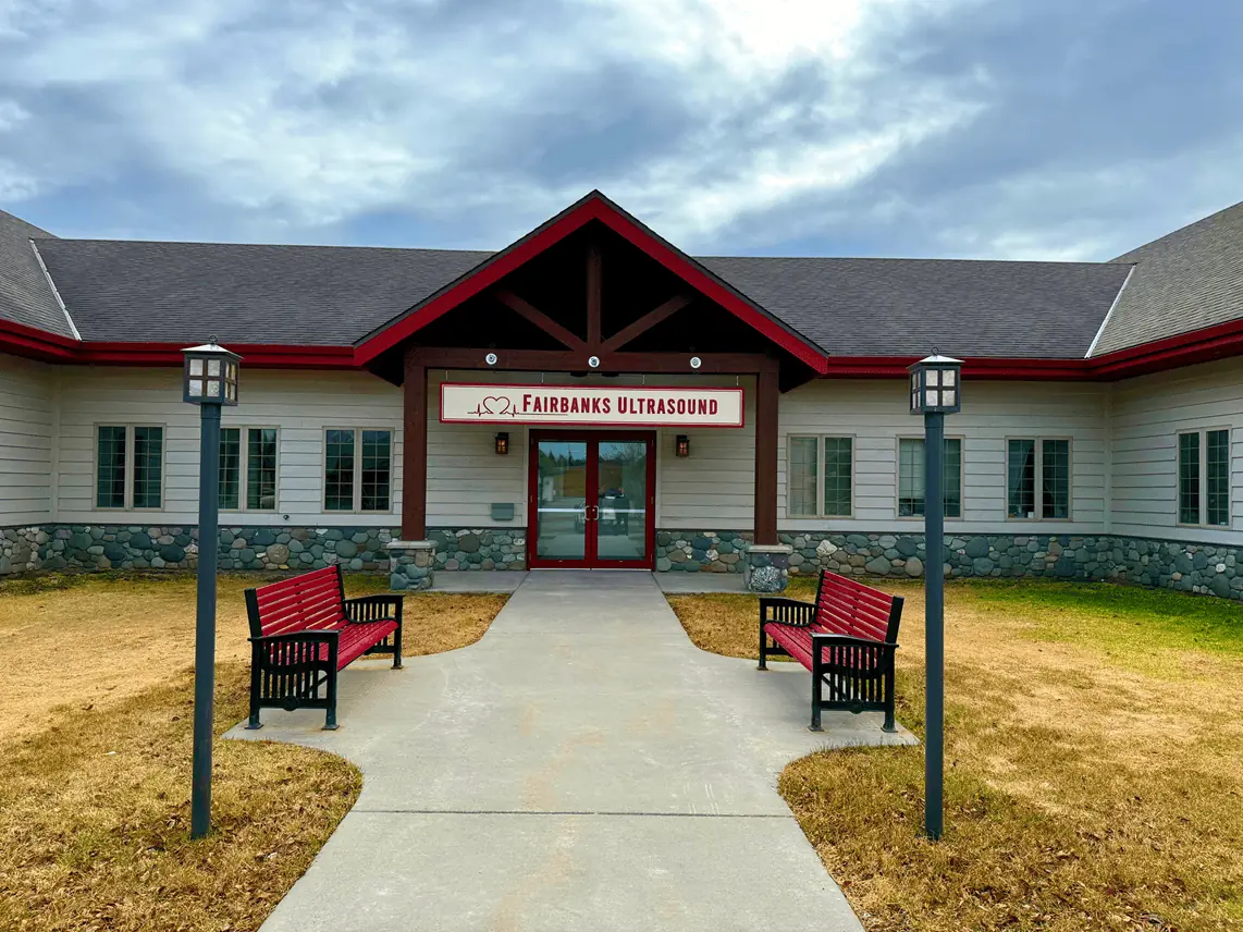 Front of the Fairbanks Ultrasound clinic at 570 Riverstone Way, with red benches along the walkway